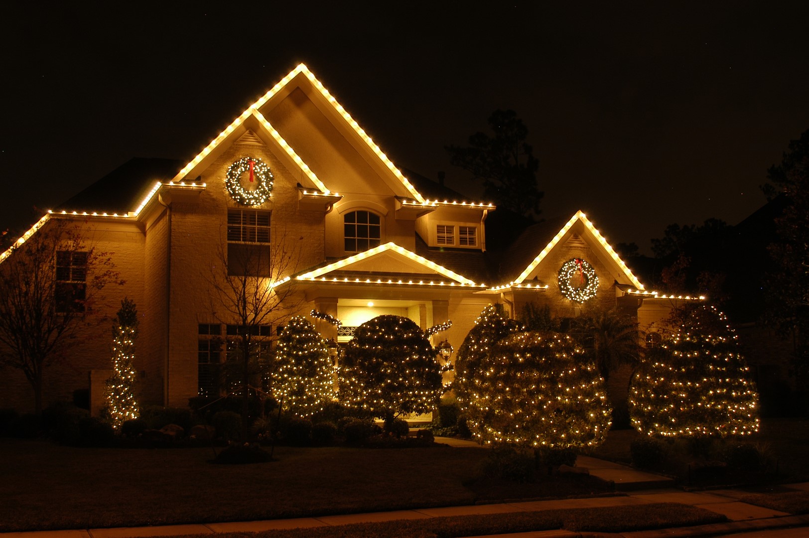 Professional outdoor lighting for winter safety and ambiance